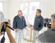  ?? ASSOCIATED PRESS FILE PHOTO ?? Texas Land Commission­er George P. Bush, right, and the Federal Emergency Management Agency’s Hurricane Harvey coordinato­r, Kevin Hanne, discuss a storm-damaged Nome, Texas, home that is being repaired using federal funds.