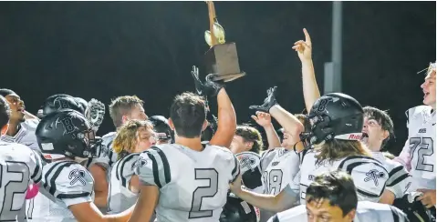  ?? CHRISTIE HEIDELBERG/SPECIAL to The Saline Courier ?? The Bauxite Miners celebrate after defeating Harmony Grove 39-26 on Friday at Sykes Stadium in Haskell. The win was the third straight for the Miners in the crosscount­y rivalry — the Saline River Showdown.