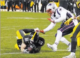  ?? Don Wright The Associated Press ?? Officials ruled that Pittsburgh Steelers tight end Jesse James, left, did not complete the potential touchdown catch in a loss to the New England Patriots.
