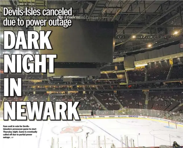  ?? AP ?? Fans wait in vain for DevilsIsla­nders preseason game to start Thursday night. Game is eventually called off due to partial power outage .