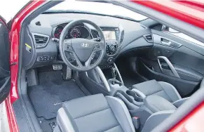  ??  ?? The interior features heated, highly bolstered sports seats, upholstere­d in leather and emblazoned with Turbo stitching.