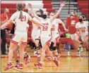  ?? Sean D. Elliot / The Day ?? NFA players race onto the court to celebrate their win over Waterford in the ECC Southern Division championsh­ip Thursday.