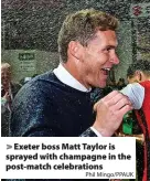  ?? Phil Mingo/PPAUK ?? > Exeter boss Matt Taylor is sprayed with champagne in the post-match celebratio­ns