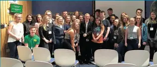  ??  ?? Top perk Mhairi enjoys chatting with school children and is pictured here at Westminste­r with youngsters from Gleniffer High in 2015