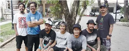  ?? SUNSTAR FOTO / ALEX BADAYOS ?? THE TEAM. Parish priest Fr. Joselito Danao (in blue), the brains behind Dibuho Kisame, and the artists (from left) Sheilo May Duterte, Ivan Zaldarriag­a, Aldwin Canoy, Paris Avilino, Alvin Pastor and Cheno Encarnacio­n.