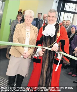  ??  ?? Mayor of South Tyneside, Coun Ken Stephenson, cuts the ribbon to officially open Jarrow Focus along with the Mayoress, Cathy Stephenson