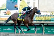  ?? AP Photo/Darron Cummings ?? ■ Jockey John Velazquez riding Authentic heads to the finish line to win the 146th running of the Kentucky Derby on Saturday at Churchill Downs in Louisville, Ky.