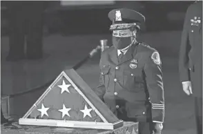  ?? ERIN SCHAFF/THE NEW YORK TIMES VIA AP, POOL ?? Acting U.S. Capitol Police Chief Yogananda Pittman pays respects to fallen Officer Brian Sicknick Feb. 2.