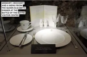  ?? ?? MEMORY: CROCKERY AND A MENU FROM THE QUEEN ELIZABETH DINNER AT THE
BATTLE OF THE BOYNE VISITOR CENTRE
