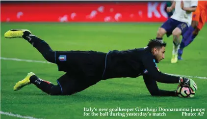 ??  ?? Italy's new goalkeeper Gianluigi Donnarumma jumps for the ball during yesterday’s match Photo: AP