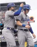  ?? JEFF CHIU/ASSOCIATED PRESS ?? The Dodgers’ Matt Kemp, left, and Cody Bellinger celebrate after they scored on a double by Joc Pederson on Saturday at San Francisco.