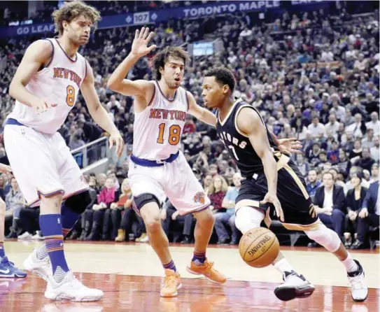  ??  ?? TORONTON: Toronto Raptors’ Kyle Lowry (7) drives toward New York Knicks’ Sasha Vujacic (18) and Robin Lopez (8) during the first half of an NBA basketball game. — AP