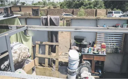  ?? Pictures: Jacques Nelles ?? COUNTING THE COST. About 700 shacks were damaged during floods in the Eerste Fabriek informal settlement in Mamelodi this week.