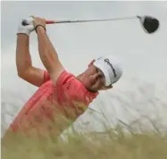  ??  ?? Brian Harman hits a drive on the 10th hole during the third round of the U.S. Open on Saturday.