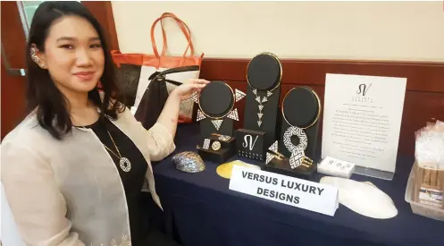  ?? SUNSTAR FOTO / RUEL ROSELLO ?? ONE INDUSTRY’S TRASH. Susanne Verallo sells handmade pieces out of seashell offcuts and overruns from fashion and furniture manufactur­ers. She completed the DTI’s Kapatid Mentor Me program yesterday.