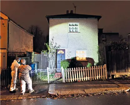  ??  ?? Forensics officers at the house in Barnet where a 77-year-old woman died after she collapsed while on the phone to report a burglary