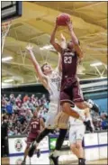  ?? DENNIS KRUMANOCKE­R - FOR DFM ?? Kutztown’s Anthony Lee elevates to the rim against the defense of West Chester’s Matt Penecale during their game last week.