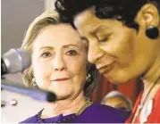  ?? Charles Rex Arbogast / Associated Press ?? Democratic presidenti­al candidate Hillary Rodham Clinton listens to an introducto­ry poem by Geneva Reed-Veal, the mother of Sandra Bland.