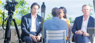  ?? AP PHOTOS ?? Director Cary Joji Fukunaga (left) and actor Daniel Craig are interviewe­d during the launch of the latest instalment of the James Bond film franchise, in Oracabessa, Jamaica, Thursday, April 25, 2019.