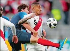  ?? NATACHA PISARENKO/AP PHOTO ?? Peru’s Pablo Guerrero, right, is challenged by France’s Benjamin Pavard during the World Cup match on Thursday at Yekaterinb­urg, Russia.