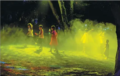 ?? RAN MENGJUN / FOR CHINA DAILY ?? A field, bathed in laser light with a water-sprinkler system, provides a perfect playground for children in Nanbin Park, Wanzhou district, Chongqing, as evening falls on June 25. The park, after a general upgrade with revamped leisure areas, has become a haven for local residents to escape the intense summer heat.
Online