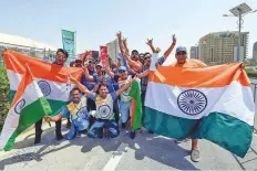  ?? Ahmed Ramzan/Gulf News ?? Indian supporters make a splash before the clash against Pakistan at Dubai Internatio­nal Cricket stadium yesterday.