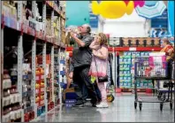  ?? NWA Democrat- Gazette/ JASON IVESTER ?? Stuart and Barbara Drizner of Holiday Island shop Tuesday at Sam’s Club in Bentonvill­e. Sam’s Club has reduced its privatelab­el brands from 21 to one — Member’s Mark — and plans to introduce 300 new private- label items this year.