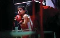  ??  ?? Young boxer Sulayman looks on during a training session at the Box Clever Sports club.
