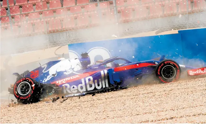  ?? Photo / Getty Images ?? Kiwi F1 driver Brendon Hartley crashes heavily last weekend in Barcelona during practice.