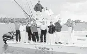  ?? ENDLESS IMAGERY/COURTESY ?? The crew of Crescendo, with Capt. Skip Dana at the helm, at the dock after winning Operation Sailfish.