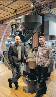  ??  ?? Jesse Messom, left, of Bigfoot Industrial Services, with Phil Robertson of Phil & Sebastian Coffee Roasters, and the roaster that Bigfoot refurbishe­d.