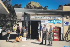  ??  ?? Larry Sandhu, owner of the Jenner Sea (C for short) Store, talks with Joseph Gowen, who has lived in Jenner for 64 years. Sandhu recalls the accused killer buying sodas.