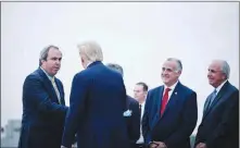  ?? T.J. KIRKPATRIC­K / THE NEW YORK TIMES ?? Then-president Donald Trump greets Joe Gruters, left, chairman of the Florida Republican Party, in January 2020 at Miami Internatio­nal Airport. The Republican National Committee tapped Gruters to head its “election integrity” committee, a group of 24 RNC members tasked with developing legislativ­e proposals on voting systems.in January, Gruters used a #stoptheste­al hashtag and advertised ways for Republican­s to attend the Jan. 6 rally that ended with a riot at the Capitol.