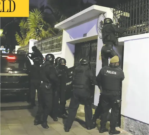  ?? AP PHOTO / DAVID BUSTILLOS ?? Police break into the Mexican embassy in Quito, Ecuador, on Friday. The raid took place hours after
the Mexican government granted former Ecuadorean vice-president Jorge Glas political asylum.