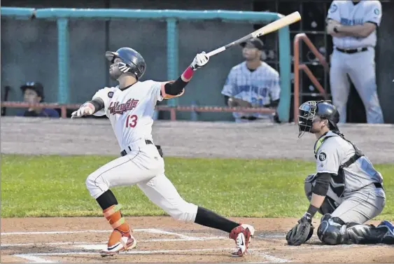  ?? Photos by Hans Pennink / Special to the Times Union ?? Tri-city’s Carlos Machado watches his opposite-field home run Saturday against Hudson Valley in Game 1 of the New York-penn League title series.