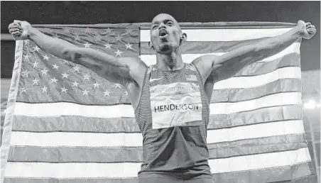  ?? Natacha Pisarenko / Associated Press ?? Jeff Henderson celebrates his dramatic achievemen­t Saturday. His sixth and final jump proved to be the winner for the American, whose 27-6 leap outdistanc­ed his foes and captured the gold medal in the long jump in Rio de Janeiro.