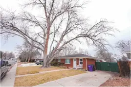  ?? DAVID ZALUBOWSKI/ASSOCIATED PRESS ?? The residence where a former funeral home owner kept a deceased woman’s body in a hearse for two years as well as the remains of 30 cremated people is shown Friday in southwest Denver. The discovery occurred on Feb. 6 during a court-ordered eviction of the home rented by 33-year-old Miles Harford, who authoritie­s are seeking to arrest.