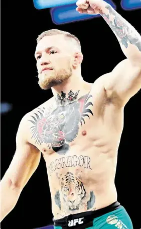  ?? Bývalý boxerský šampion několika váhových kategorií Floyd Mayweather jr. (vlevo) a aktuální vládce UFC v lehké váze Conor McGregor. FOTO ČTK/ AP ??