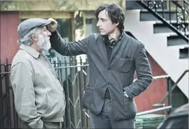  ?? Netf lix ?? WRITER-DIRECTOR Noah Baumbach, right, adjusts Dustin Hoffmann’s cap on the set of Baumbach’s latest film, “The Meyerowitz Stories (New and Selected).”