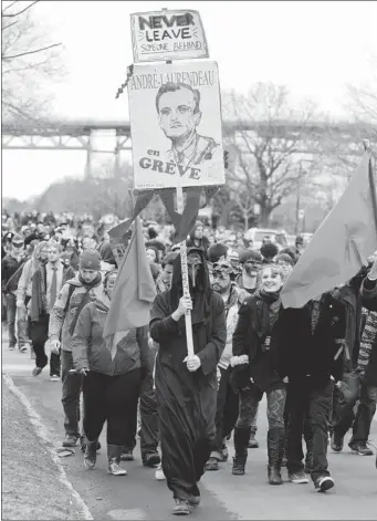  ?? JOHN MAHONEY THE GAZETTE ?? Students chose a number of pre-determined routes for protest marches. This one on René Lévesque Blvd. placed more emphasis on inventive costumes. The protesters partied after the marches came together.