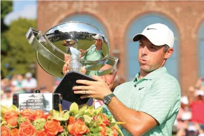  ?? ?? Rory McIlroy celebrates with the FedEx Cup after his victory on Sunday. Photograph: Kevin C Cox/Getty Images