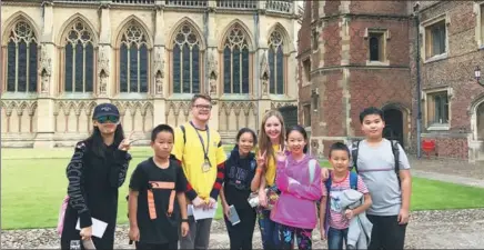  ?? PROVIDED TO CHINA DAILY ?? Students gather at a summer school in the UK. In recent years, overseas summer study camps have become very popular among Chinese students.