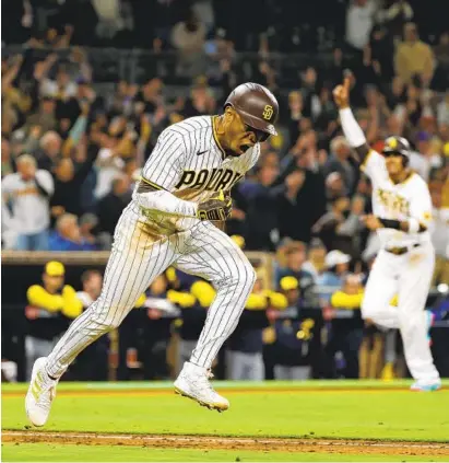  ?? K.C. ALFRED U-T ?? Padres’ Jose Azocar runs to first base after the winning hit in the 10th inning against Milwaukee on Monday night at Petco.