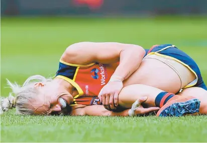  ??  ?? Adelaide Crows co-captain
Erin Phillips after rupturing her ACL in the AFLW grand final in March.
