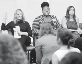  ?? Seth Wenig / Associated Press ?? Actress Amy Poehler, left, indicates that she once worked as a waitress, as Shanita Thomas, center, and Gemma Rossi listen during a discussion about subminimum wage workers in New York.