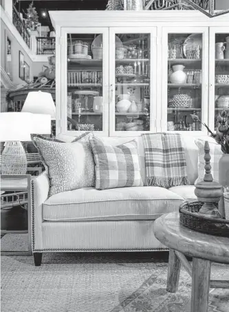  ?? Courtesy photo ?? Neutral-colored plaid provides a pop of style without overwhelmi­ng a space.