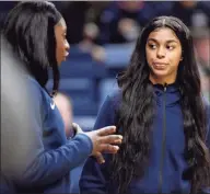  ?? Jessica Hill / Associated Press ?? UConn’s Evina Westbrook, right, talks with teammate Batouly Camara as their team warms up prior to an NCAA women’s exhibition basketball game against Jefferson on Nov. 3 in Storrs.