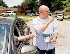  ?? [PHOTOS BY PAUL HELLSTERN, THE OKLAHOMAN] ?? Republican Joe Griffin canvasses the neighborho­od near Sara Road and SW 29 in Oklahoma City in his campaign to represent state Senate District 44.