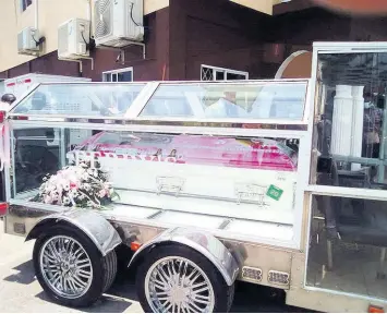  ?? PHOTO BY RUDDY MATHISON ?? A carriage is seen with the coffin bearing the remains of Khanice Jackson outside Perry’s Funeral Home on Wednesday. The burial was postponed last week to allow for Khanice’s father, Roy Jackson, to return to Jamaica in time after recovering from COVID-19.