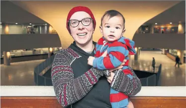  ?? ANDREW FRANCIS WALLACE/TORONTO STAR ?? Carolyn Ferns of the Ontario Coalition for Better Child Care, pictured with her 8-month-old son, Rowan, took her concerns online election night: “The next few years will be a challenge for our community.”